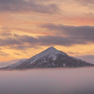 Sunrise over a misty Schiehallion